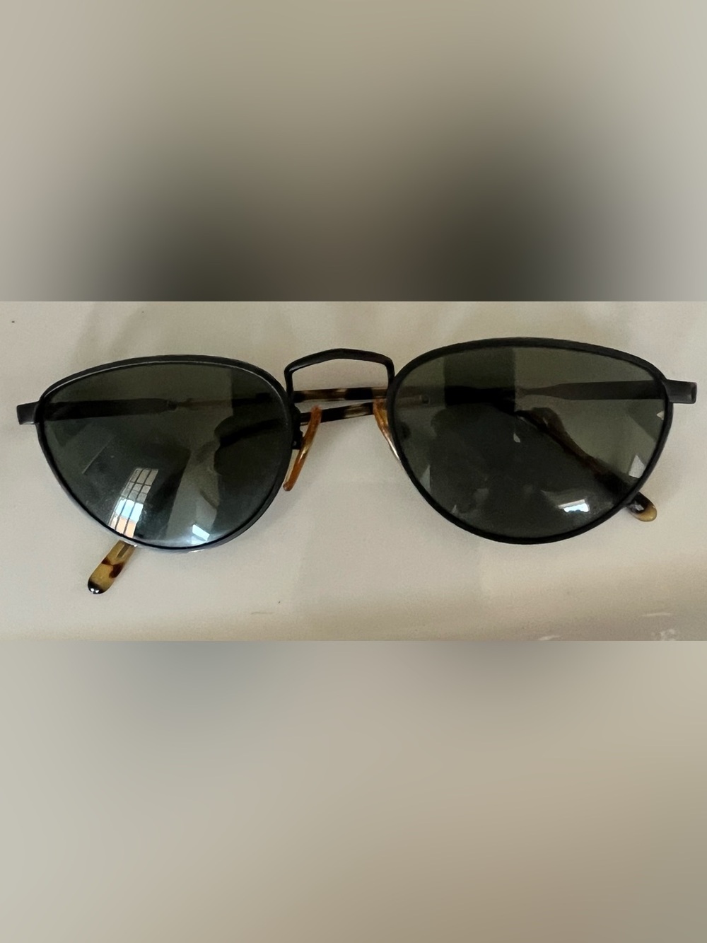 Vintage Oval Black Sunglasses with Tortoiseshell Nose Pads
